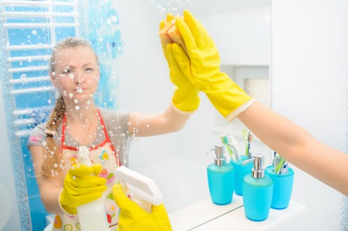 Cleaning team in W14 preparing a spotless kitchen and bathroom